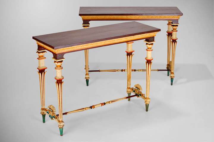 A Pair of Italian Neo-Pompeian Polychrome-painted and Carved Wood Console Tables and a set of six stools en suite.Kingdom of Two Sicilies